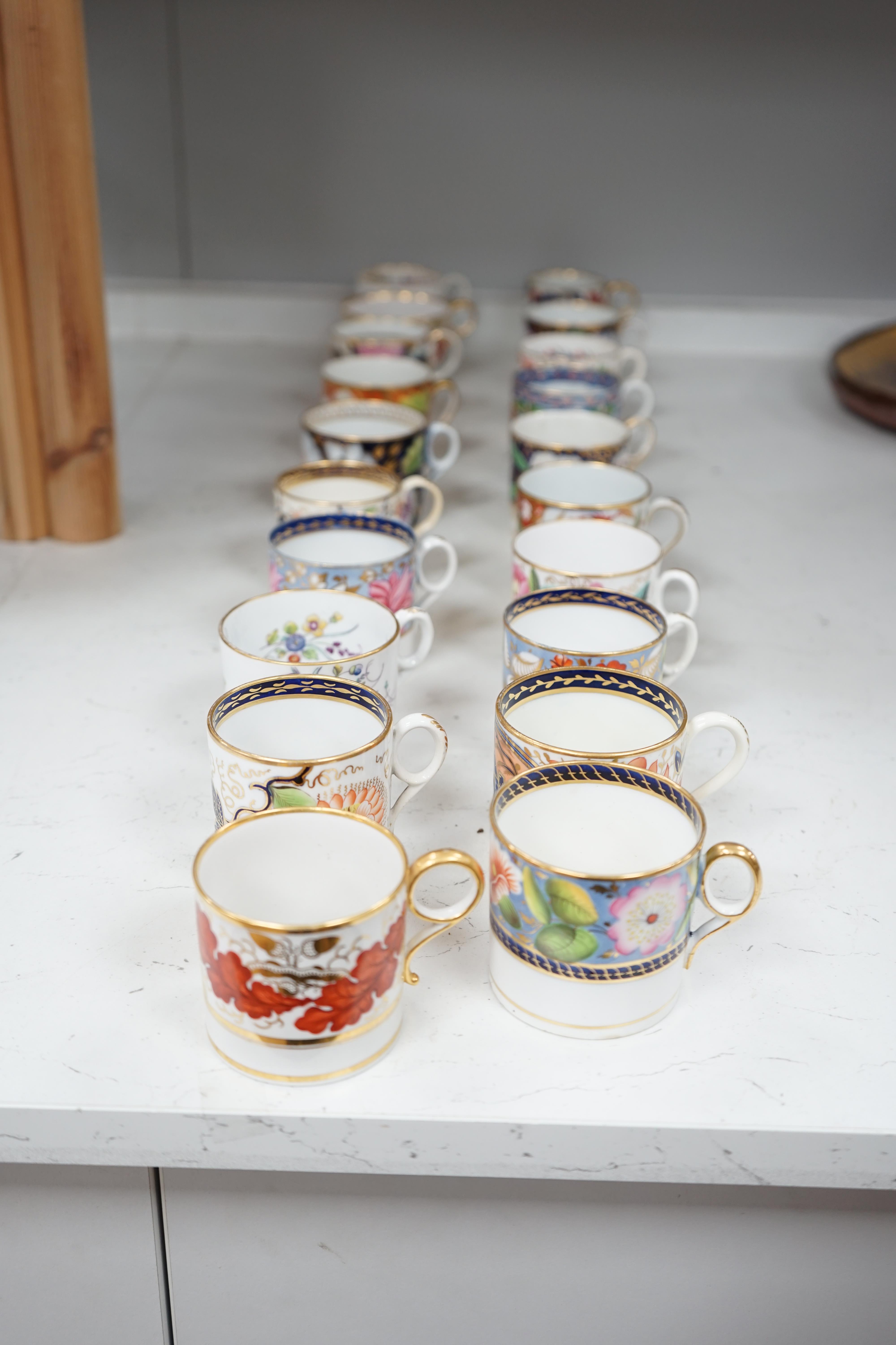 Twelve 1800-1820 English porcelain floral designed coffee cans